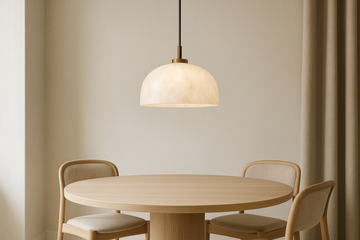 A stylish pendant light hanging above a dining table, modern home interior, soft natural light, alabaster or glass shade, neutral tones, elegant minimalist design, 1:1 ratio.